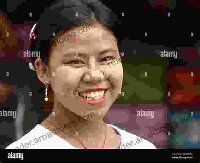 A Burmese Woman Smiles, Her Eyes Reflecting Strength And Resilience The Way To Burma: A Beautiful Chinese Story