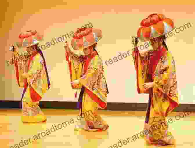 A Group Of Women Performing A Traditional Ryukyuan Dance, Showcasing The Vibrant And Graceful Artistry Of Ryukyuan Culture. Okinawa And The Ryukyu Islands: The First Comprehensive Guide To The Entire Ryukyu Island Chain