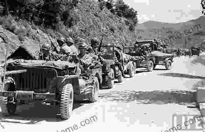 A WWII Jeep Driving Down A Dirt Road, Surrounded By Beautiful Scenery. Building A WWII Jeep: Finding Restoring And Rebuilding A Wartime Legend