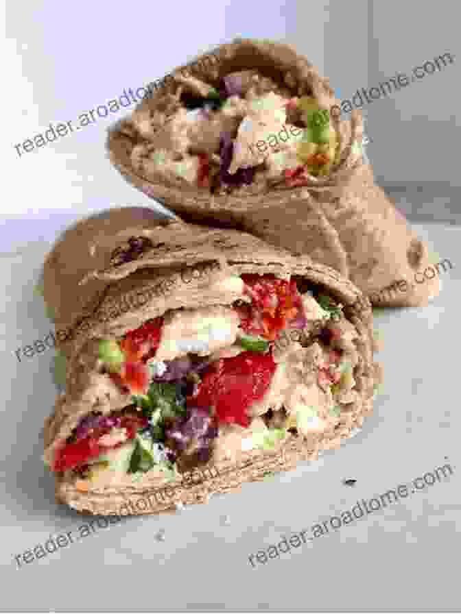 Delicious Greek Wrap Filled With Grilled Chicken, Feta Cheese, And Fresh Vegetables Easy Greek Food Recipes Anyone Can Cook: Mediterranean Diet Cuisine: Easy Greek Recipes For School